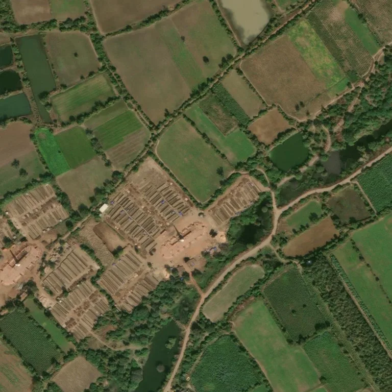 Brick kiln with rows of drying bricks in Gujarat